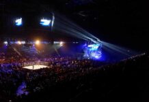 WWE Title Changes Hands in Chile Wrestling ring in a packed arena with stage lights
