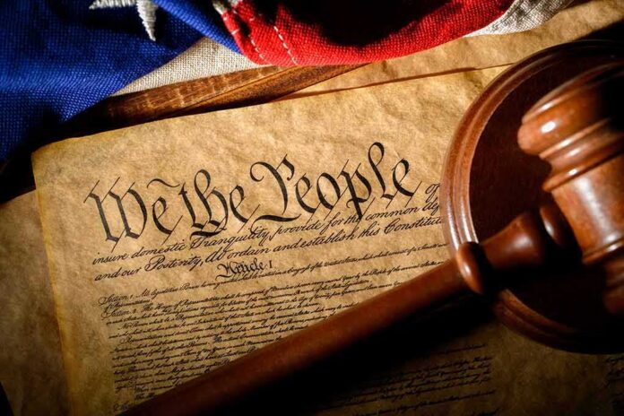 shutterstock_1650343750 U.S. Constitution with gavel and flag
