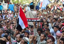 Yemen Calls for National Mobilization Crowd at a protest rally; Katherine Hull-Kirk, Farveez Maharoof, Bimal Lakra, Isha Lakhani, and Colin David Jones present
