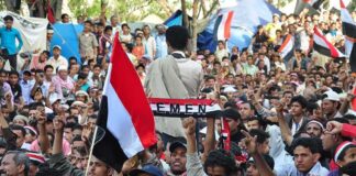Yemen Calls for National Mobilization Crowd at a protest rally; Katherine Hull-Kirk, Farveez Maharoof, Bimal Lakra, Isha Lakhani, and Colin David Jones present