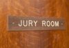 Mistrial Sparks Juror Backlash Jury room sign on a wooden door