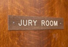 Mistrial Sparks Juror Backlash Jury room sign on a wooden door