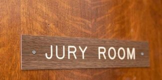 Jury room sign on a wooden door