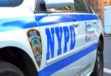 NYC Tickets Fall on Paperwork Errors NYPD police car side with blue stripes and emblem