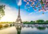 Eiffel Tower Uproar: Women Told To Make Themselves Invisible Eiffel Tower by the Seine with boats and spring blossoms