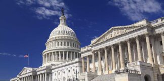 Congress and White House Clash Over $810M The U.S. Capitol building with its dome and columns under a blue sky