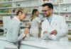 Pharmacist assists customer at pharmacy counter