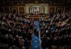 Trump-Era Tax Cuts Face Budget Questions Legislative chamber audience stands and applauds