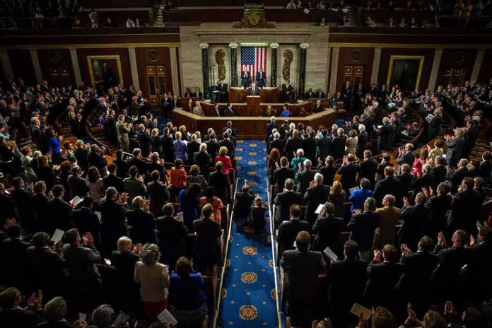 shutterstock_218485888-3 Legislative chamber audience stands and applauds