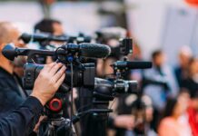 AfD Takes First in Saxony-Anhalt Video cameras on tripods at a media event