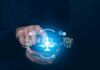 Students Turn to AI for Companionship Hands using smartphone with glowing justice scale and AI icons