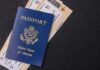 Facial Recognition Flags Passport Mismatch at Airport US passport with boarding passes on a dark surface
