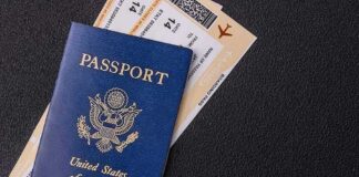 Facial Recognition Flags Passport Mismatch at Airport US passport with boarding passes on a dark surface