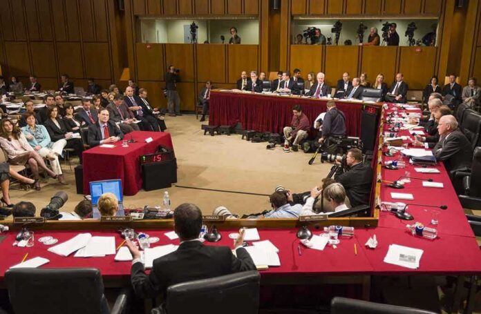 shutterstock_387761506-1 Patrick Leahy and Samuel Alito at a Senate hearing with committee and press present