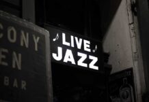 442 Comments Over One Policy Change Live jazz neon sign at night