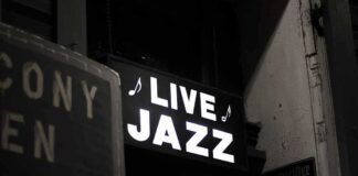 442 Comments Over One Policy Change Live jazz neon sign at night