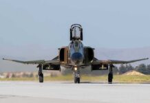 F-16 Crashes During Michigan Training Military jet taxiing on runway with open canopy