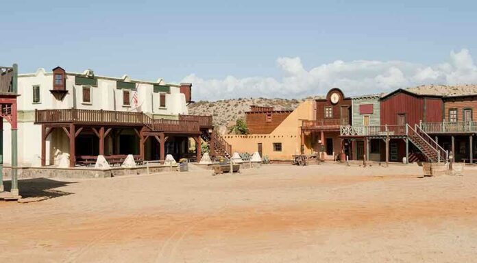 shutterstock_72492166 A deserted western town with historic buildings under a clear blue sky