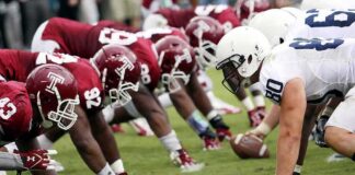 TCU Restores Newspaper Credentials After Reporting Dispute American football players lined up at the line of scrimmage