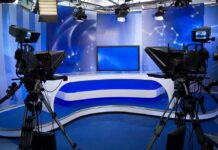 Journalist: Captive Footage Was Withheld A television studio setup with cameras and a blue backdrop