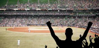Phillies Clinch Wild Card on Final Day Crowd of fans cheering at a baseball game in a stadium