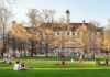 Campus Free Speech Battles Intensify Students relaxing on a campus quad in front of a brick academic building