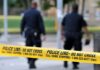 Japan Protests After Marine Arrest in Okinawa Killing Police officers walking past caution tape at a crime scene
