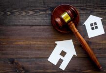 Developer Sues Over 39-Story Menlo Park Project Judge's gavel with paper house cutouts on wooden table