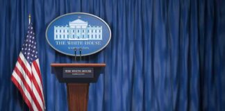 Short White House Briefing Sparks Media Criticism White House press briefing podium with U.S. flag and blue curtain