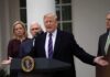 Donald Trump speaks at a podium with Mike Pence and Kevin McCarthy nearby