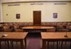 DHS Chief’s Islam Remarks Spark Debate Empty courtroom with wooden tables and gallery seating