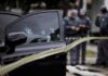 Video Captures Moments Before Bronx Shooting Car door with bullet holes at a taped-off crime scene