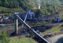 Winter Fuel Rush Tightens Asian Coal Supply Coal processing plant with conveyor belts in a forested valley