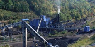 Winter Fuel Rush Tightens Asian Coal Supply Coal processing plant with conveyor belts in a forested valley
