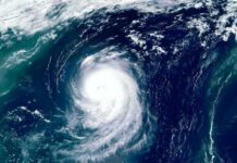 Cyclone Weakens After Devastating Landfall Satellite view of a powerful hurricane swirling over the ocean