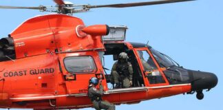 Missing Medical Jet Debris Found Near Nantucket Rescue helicopter with crew performing hoist operation