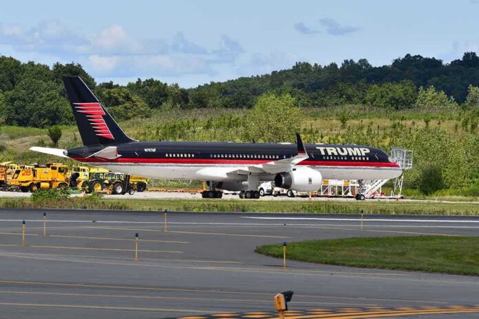 shutterstock_1626094870-1 Private jet with black and red livery parked on airport tarmac