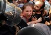 Protesters Removed From Trump Rally Amid Chants Protesters clash with riot police as woman shouts