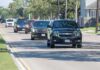 Storms Force Trump’s High-Speed Dash motorcade of black SUVs driving down a suburban street