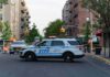 One-Year-Old Killed in Queens Stroller Crash NYPD police SUV blocking a city street at a taped-off scene