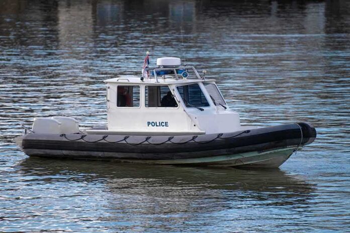 shutterstock_2131906271 Police patrol boat on calm water
