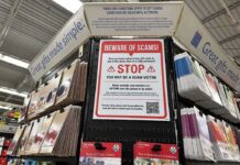 $963K Trading Card Heist Shocks Collectors Gift card display with scam warning sign