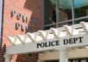 Former Educator Pleads Not Guilty to Felony Charges Police department entrance with pergola and brick wall