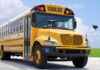 Yellow school bus parked on pavement