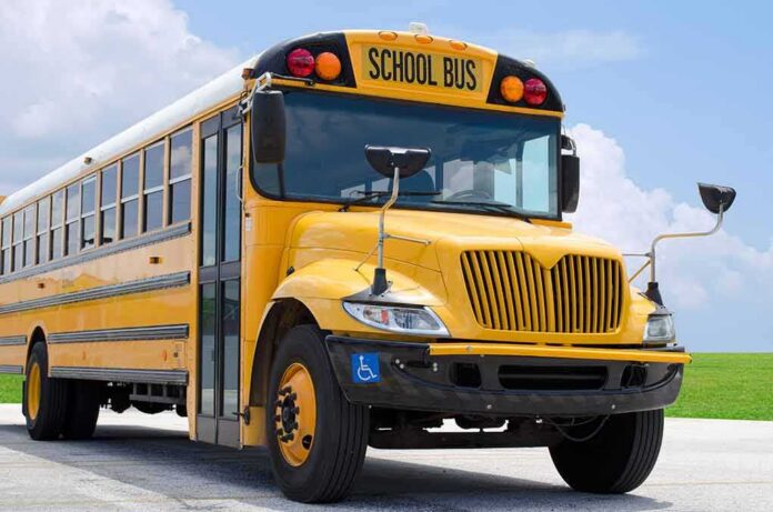 shutterstock_271198973 Yellow school bus parked on pavement