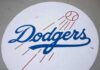 Dodgers Fan Says No to Young Fan Dodgers logo with baseball and motion lines