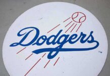 Dodgers logo with baseball and motion lines