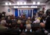 Trump Moves to Fill Press Secretary Vacancy Press secretary at podium addressing reporters in briefing room