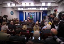 Trump Moves to Fill Press Secretary Vacancy Press secretary at podium addressing reporters in briefing room
